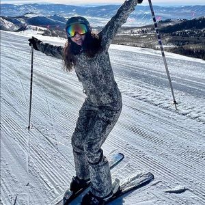 Women’s one piece snakeskin ski suit onesie.  Obsessed but I only went Skiing 2x